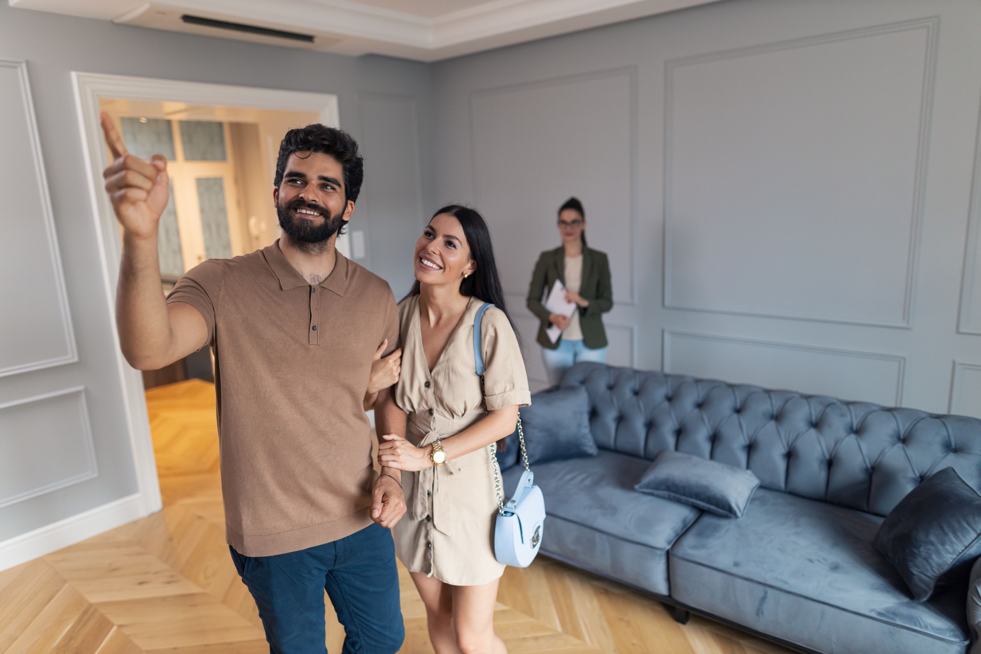 Happy couple enjoying in real estate showing.